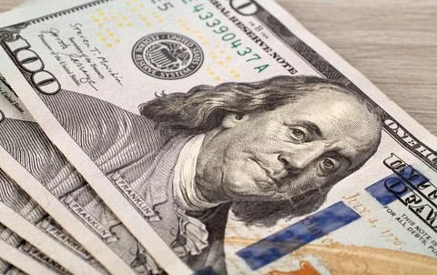 A $100 dollars bill with focus on Benjamin Franklin. Stock Photos