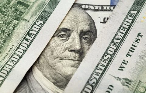 A $100 dollars bill with focus on Benjamin Franklin. Stock Photos