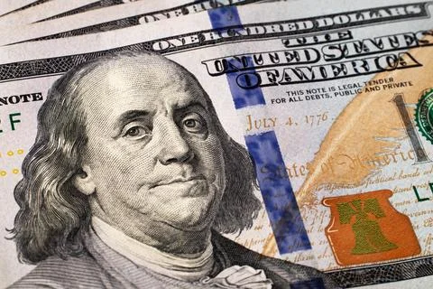 A $100 dollars bill with focus on Benjamin Franklin. US banknotes close-up. Stock Photos