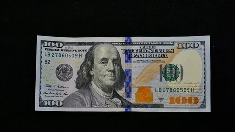 100 dollars on black background Stock Footage 70500067