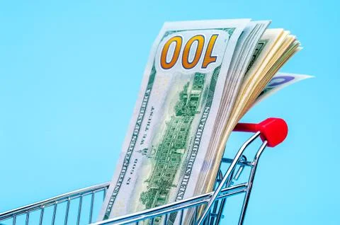 100 dollars note in a tiny basket Stock Photos