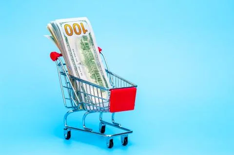 100 dollars note in a tiny basket Stock Photos