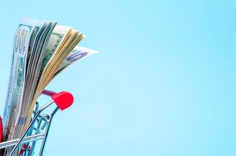 100 dollars note in a tiny basket Stock Photos