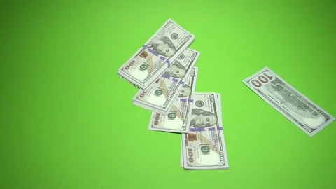 100 dollars notes is falling into green background. Slow motion 120fps Stock Footage 85394912