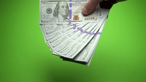 100 dollars notes waving in the male hands. Slow motion 120fps Stock Footage 85394983