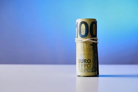 A 100 euro bill is wrapped in a string Stock Photos
