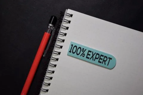 100% Expert write on sticky note isolated on black table. Stock Photos