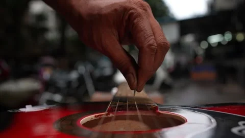 100 fps Guitar playing with blurred background in roadside 库存影片 246807738