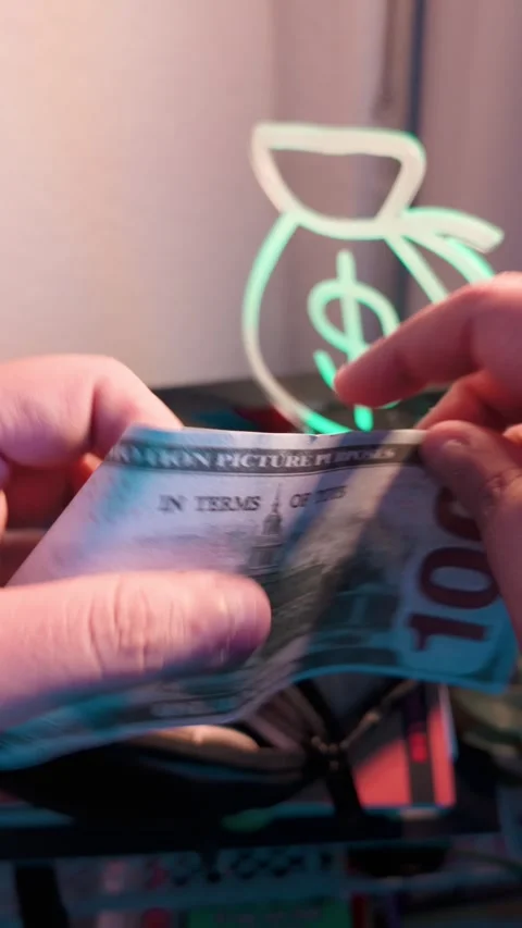 A $100 prop bill being cut in half Stock Footage 303948705