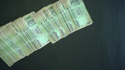 100 Rupees Notes Sliding On Table | Stock Video | Pond5