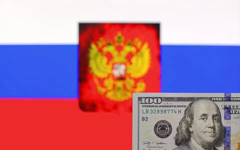 100 US dollars on blurred background of Russian Federation flag Stock Photos