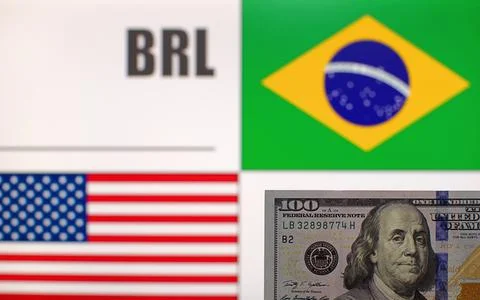 100 US dollars on blurred background of Brazil and USA flags Stock Photos