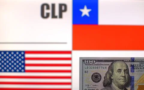 100 US dollars on blurred background of Chile and USA flags Stock Photos