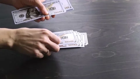 100 USA dollar banknotes bundle. The woman counts the money. Counting process.  Stock Footage 219862404