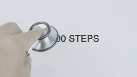 10000 Steps word diagnosed with hand holding stethoscope on white background Stock Footage 315208265