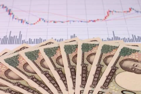 10,000 yen notes and graph Foto stock