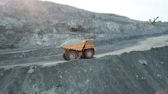 Large dump truck carries chalk ore in the quarry. Mining industry.