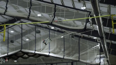 100143, Pole Vaulting over High bar clearing bar Stock Footage 127634120