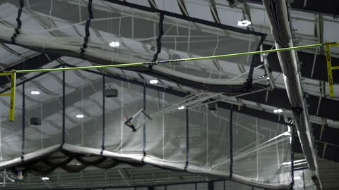 100144, Pole Vaulting over High bar clearing bar Stock Footage 127634132