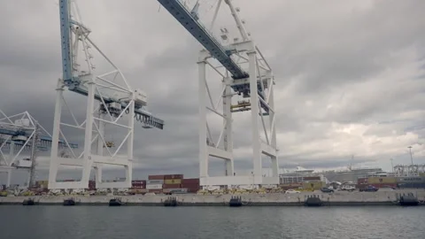 10/07/2023 Crane unloading freight cargo container dockside Miami Florida Stock Footage 264344439