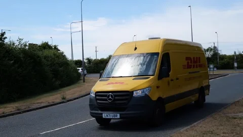 100fps. DHL delivery van, parcel delivery, courier van. Hull.UK 4.7.2026 Stock Footage 338346005