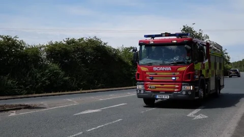 100fps. UK fire engine, emergency vehicle, flashing lights. Hull.UK 6.7.2026 Stock Footage 338346045