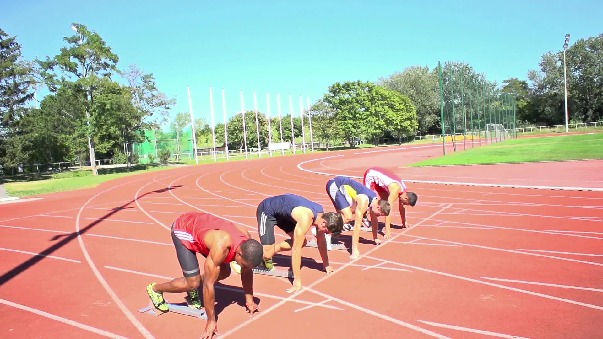 Slow motion of four sprinters on start Stock Video Footage by ©amriphoto  #102756702