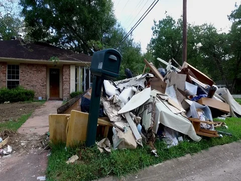 10/10/17 Dickinson, TX: Trash and debris on the streets of a flooded home 스톡 동영상 80924019