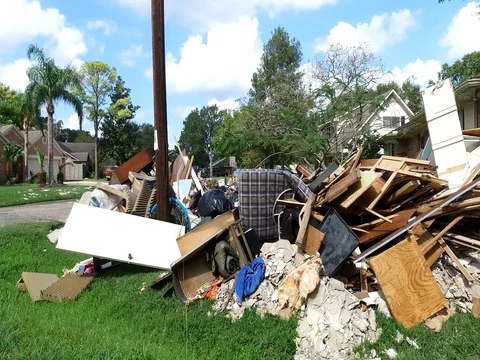 10/10/17 Dickinson, TX: Trash and debris on the streets of a flooded home Stock Footage 80925346