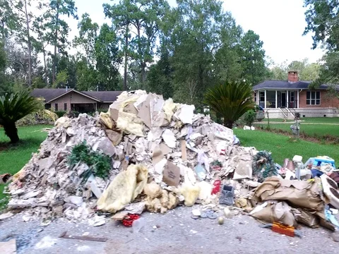 10/10/17 Dickinson, TX: Trash and debris on the streets of a flooded home Stock Footage 80933193