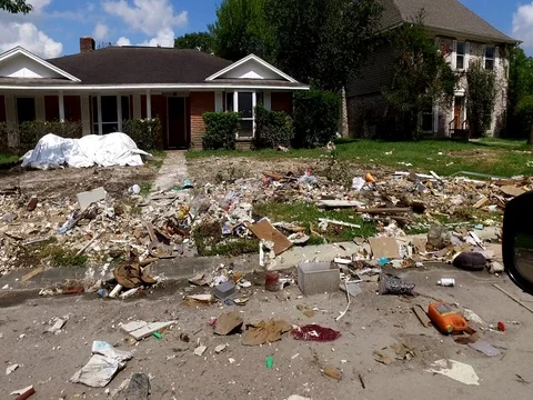 10/10/17 Dickinson, TX: Trash and debris on the streets of a flooded home Stock Footage 80933693