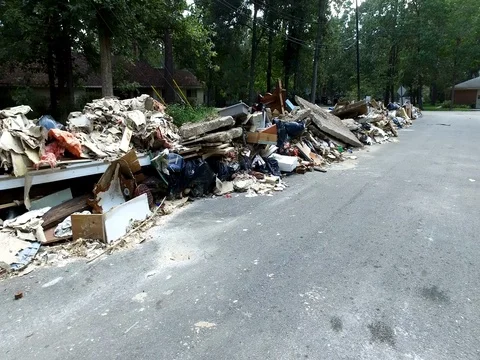 10/10/17 Dickinson, TX: Trash and debris on the streets of a flooded home Stock Footage 80933989