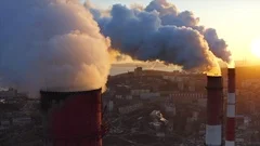 Panoramic aerial view of high chimneys of Central Heating and Power Plant. Smoke