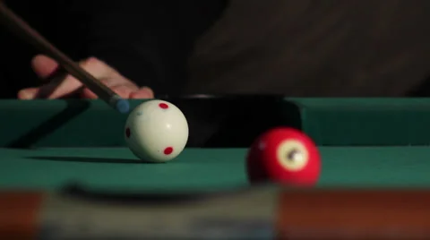 10/35 Man playing billiard. Player is taking a shot and put ball in the hole. Video stock 36427346