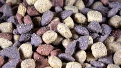 Multicolored dog food kibble spinning video