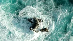Sea wave hits a rock