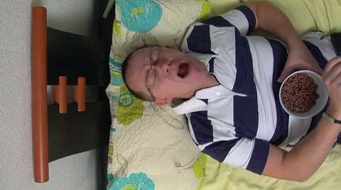 10664 man boring catch snacks sleepless Video stock 10797926