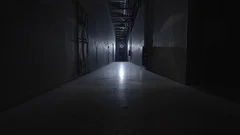 camera walking in the path inside prison with cells