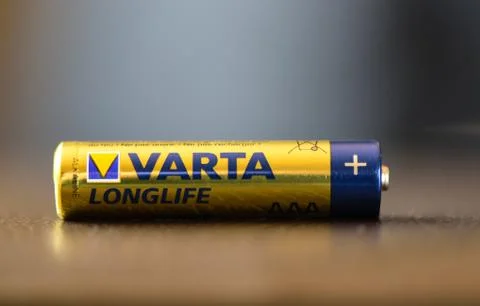 Moscow, Russian Federation - April 24, 2019: A varta AA battery. Varta AG is a Germany electronics corporation headquartered in Ellwangen, Germany. Battery over leather background. Copy space xkwx electrical, alkaline, battery, electric, electricity, aa, power, white, supply, energy, charge, sign, electronic, current, polarity, negative, recharge, cylinder, watt, component, voltage, capacity, technology, positive, one, accumulator, plus, volt, cell, equipment, metal, object, closeup, industry, isolated, minus, disposable, path, generation, conservation, clipping, recycling, background, rechargeable, device, nickel, oxide, source, chemical, cadmium