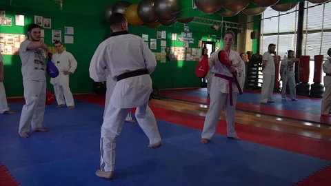 1070 Slow motion video of adult taekwondo training session in the gym, coach Stock Footage
