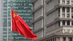 The Chinese flag flies in a business district in Shanghai, China.