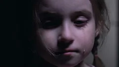 Beautiful little girl crying, defenseless victim of kidnapping, child abuse
