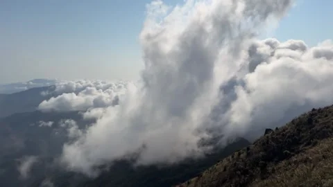 1080p Cinematic Close-Up Timelapse of Clouds Spilling Over Mountain Ridge Stock Footage 332047605