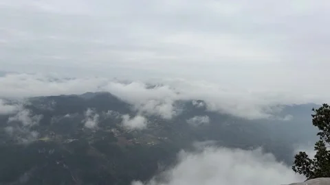 1080p Close-up Timelapse of Clouds Swirling around Rugged Mountain Peaks Stock Footage 332138886