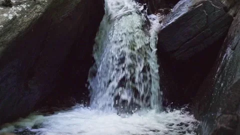 1080p slow-motion Small Waterfall in a Park Видео 265294792