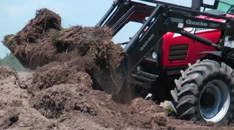 1080p/30fps tractor scoops loader full of dirt Stock Footage 50375836