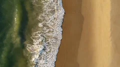 Emerald Ocean Waves Push Up onto the Sand at Virginia Beach USA
