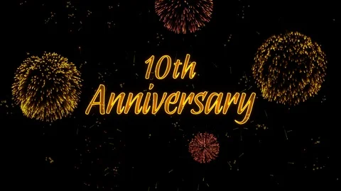 10th Anniversary Greeting text with particles, colored fireworks, sparks Stock Footage 99057350