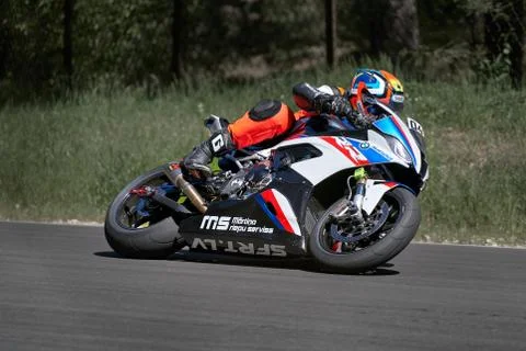 11-05-2020 Riga, Latvia Motorcyclist at sport bike rides by empty asphalt roa Fotos Stock