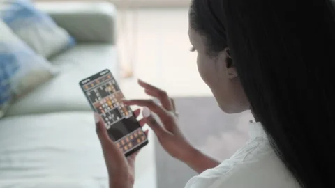 11 Black Woman Playing Sudoku On Mobile Telephone Gaming App Stock Footage